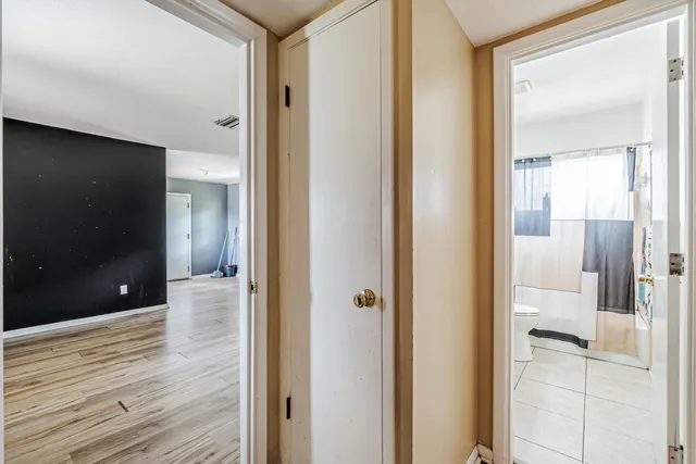 a view of a bathroom from a hallway