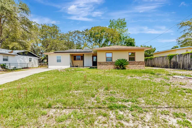 front view of a house with a yard