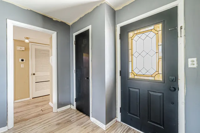 a view of kitchen with wooden floor and doors