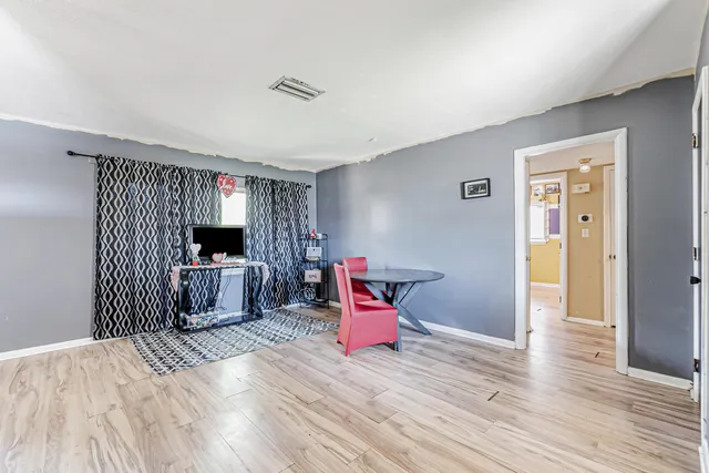 a bedroom with furniture and natural light