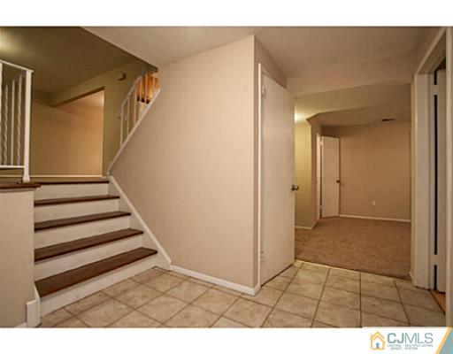 1991 Oak Tree Road Edison, NJ 08820 - Photo 2 of 20 a view of a livingroom with wooden floor and stairs
