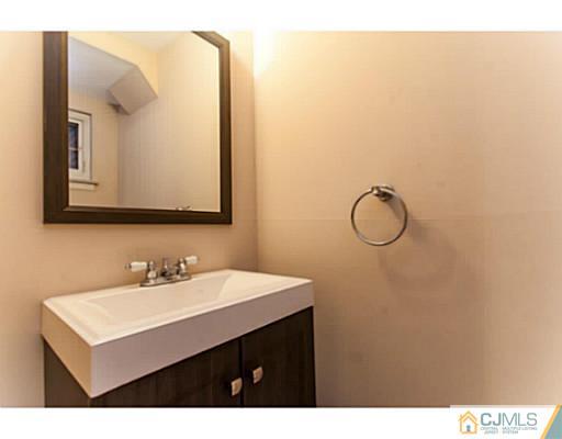 1991 Oak Tree Road Edison, NJ 08820 - Photo 9 of 20 a bathroom with a sink vanity and a mirror