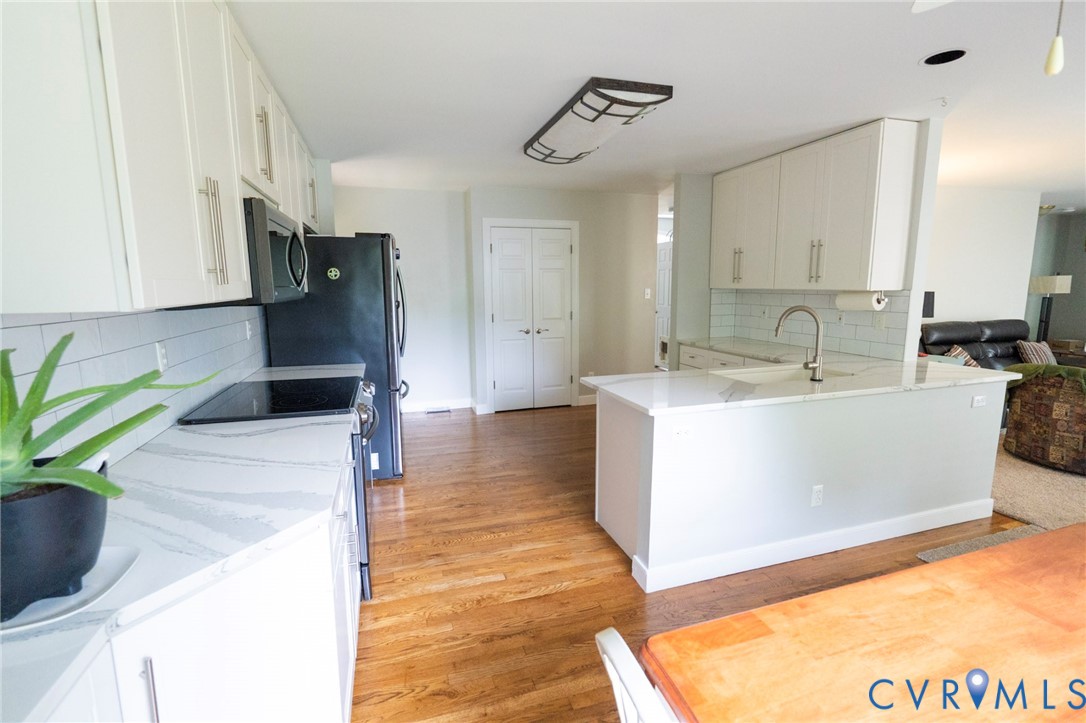 1670 Mill Quarter Road Powhatan, VA 23139 - Photo 7 of 24 Bright, open-concept kitchen featuring white cabin