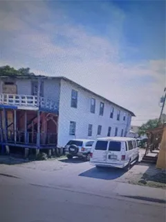 a view of a car park in front of house