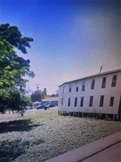 a large building with a yard