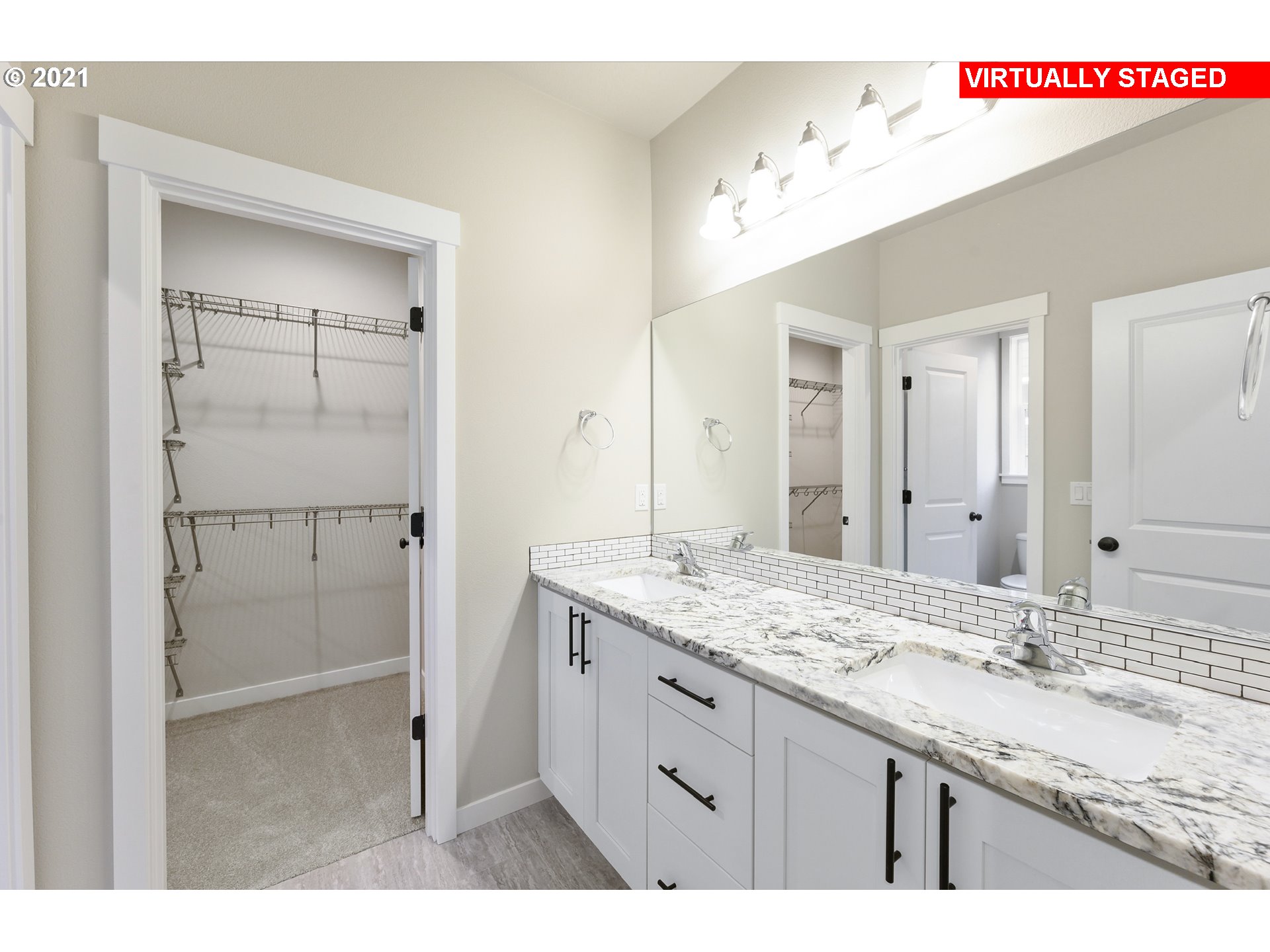 8719 North 5th Street, Unit LT50 Ridgefield, WA 98642 - Photo 5 of 31 a bathroom with a granite countertop sink mirror and double