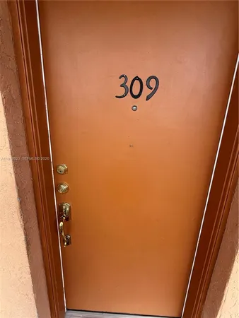 a view of a livingroom with wooden floor and furniture