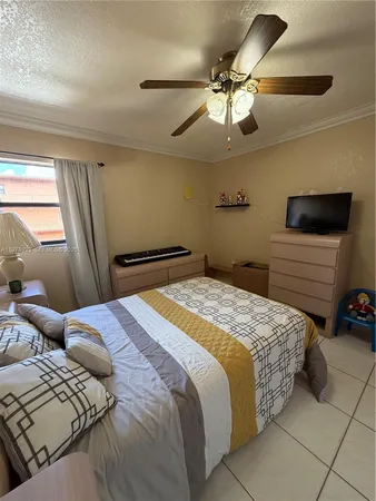 a bedroom with a bed and a sink