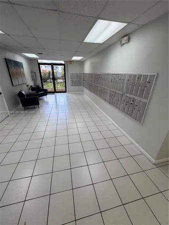 a balcony with chairs and a table