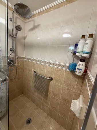 a bed room with a bed and a chandelier