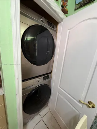 a view of a hallway to rooms and stairs