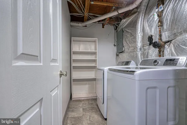 a bathroom with a sink mirror and cabinets