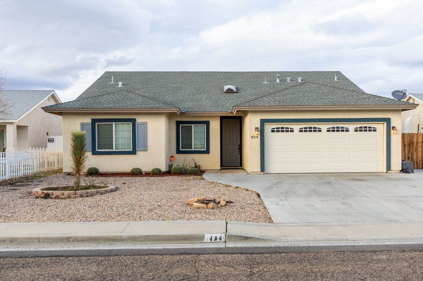 404 Christopher Court Ridgecrest, CA 93555 - Photo 1 of 31 a front view of a house with a yard