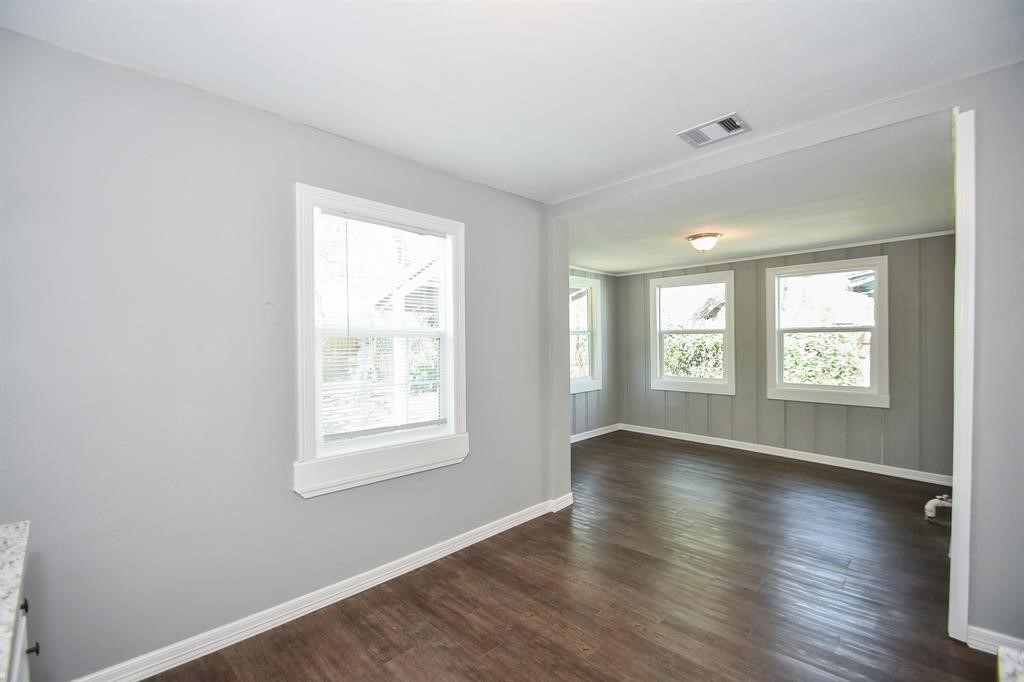 7334 Mountbatten Road Houston, TX 77033 - Photo 11 of 28 View from the kitchen into the bright dining area, enhanced by multiple windows and abundant natural light.