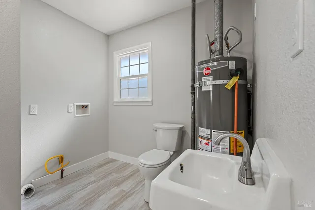 a bathroom with a sink and a window