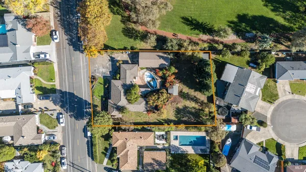 an aerial view of residential houses with outdoor space