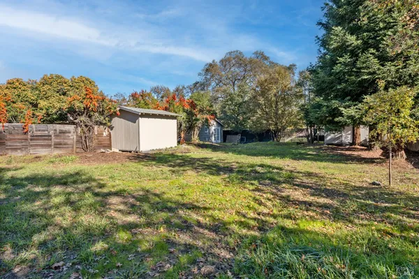 a backyard of a house with lots of green space