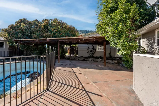 a view of a balcony with wooden floor