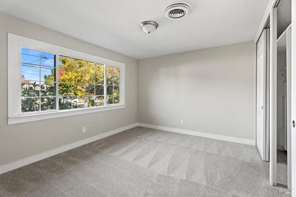 a view of an empty room with a window