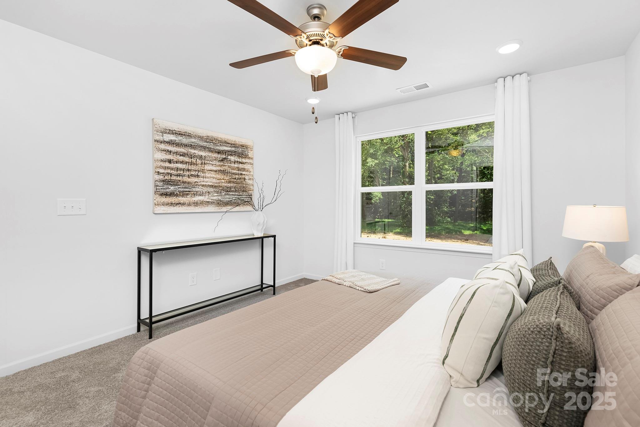 602 Westover Street Gastonia, NC 28054 - Photo 13 of 20 a bedroom with a bed and a window