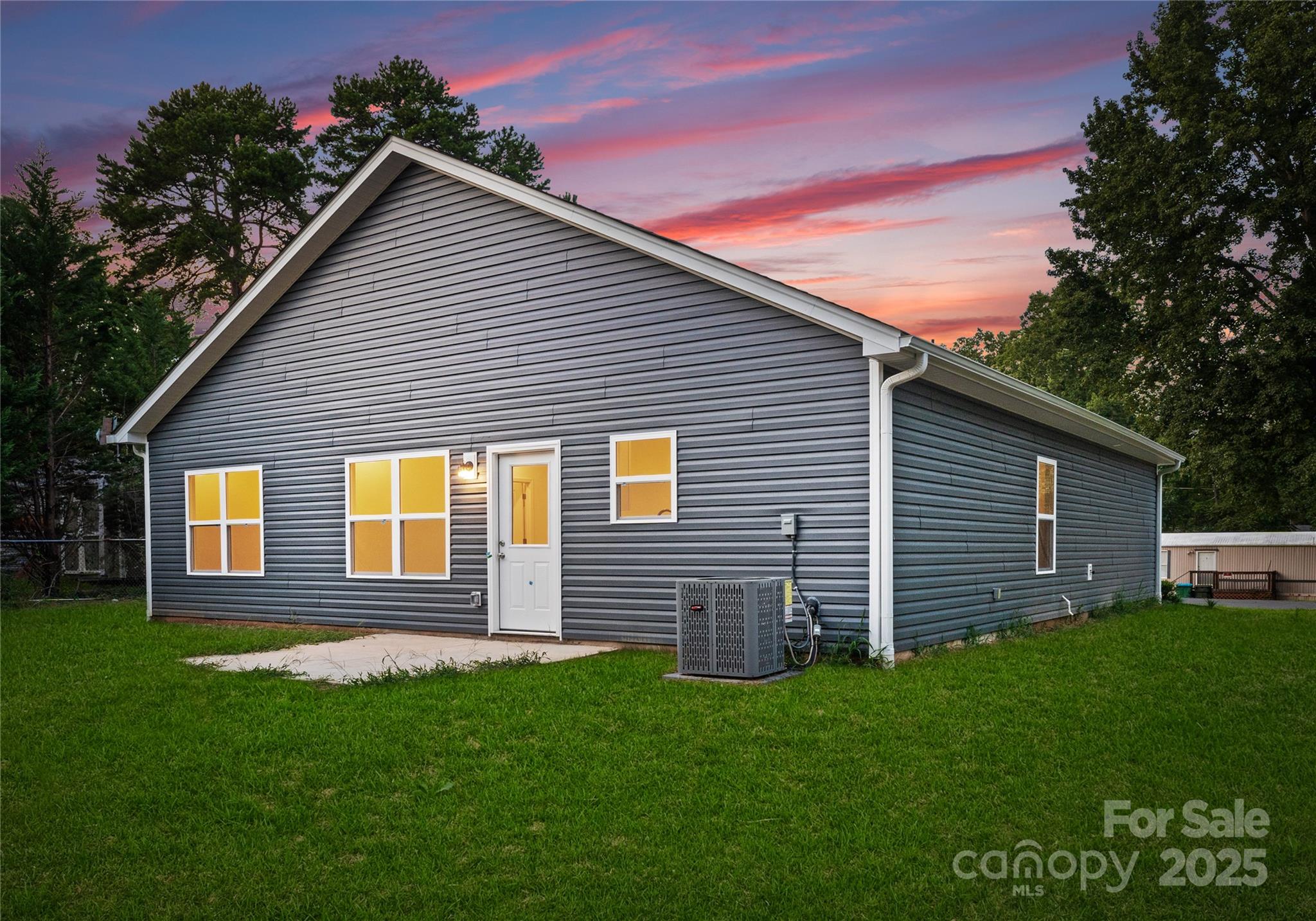 602 Westover Street Gastonia, NC 28054 - Photo 18 of 20 a view of a house with a backyard