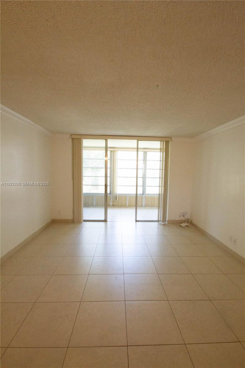3000 Northwest 48th Terrace, Unit 322 Lauderdale Lakes, FL 33313 - Photo 1 of 15 a view of an empty room with a window