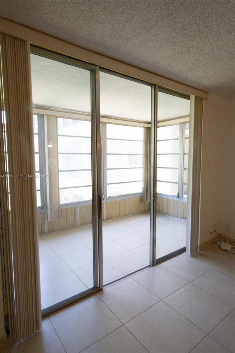 3000 Northwest 48th Terrace, Unit 322 Lauderdale Lakes, FL 33313 - Photo 5 of 15 a view of an empty room and a window