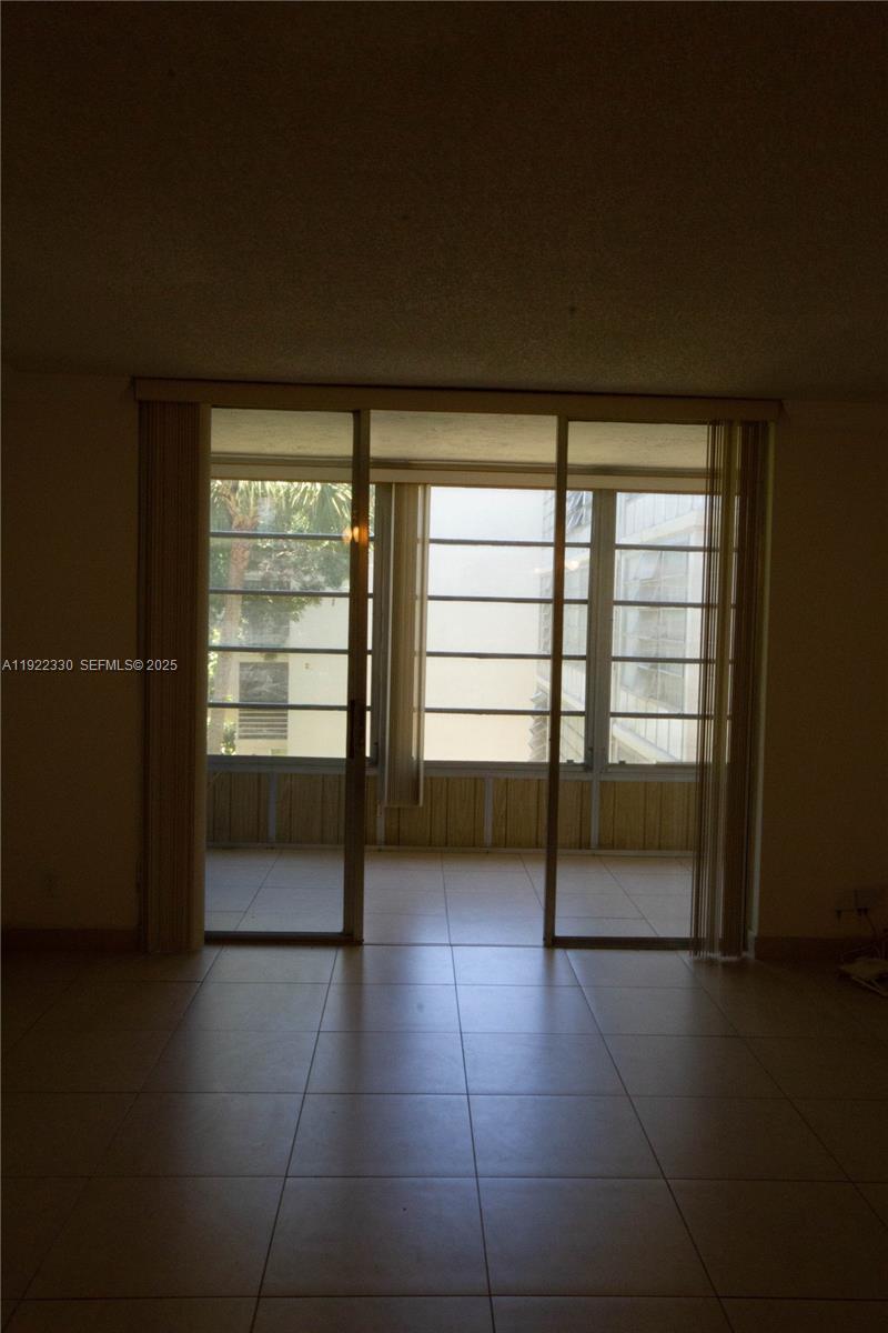 3000 Northwest 48th Terrace, Unit 322 Lauderdale Lakes, FL 33313 - Photo 6 of 15 a view of an empty room with a window