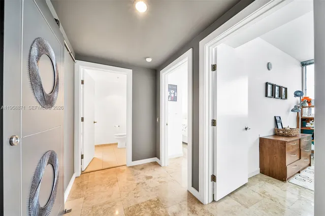 a view of a bathroom with a tub and shower