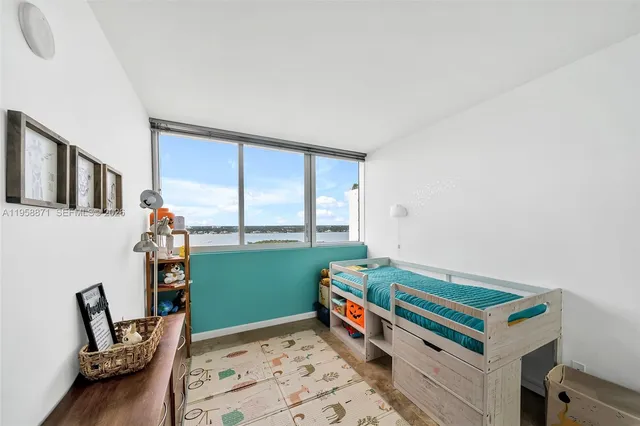 a room with window and furniture