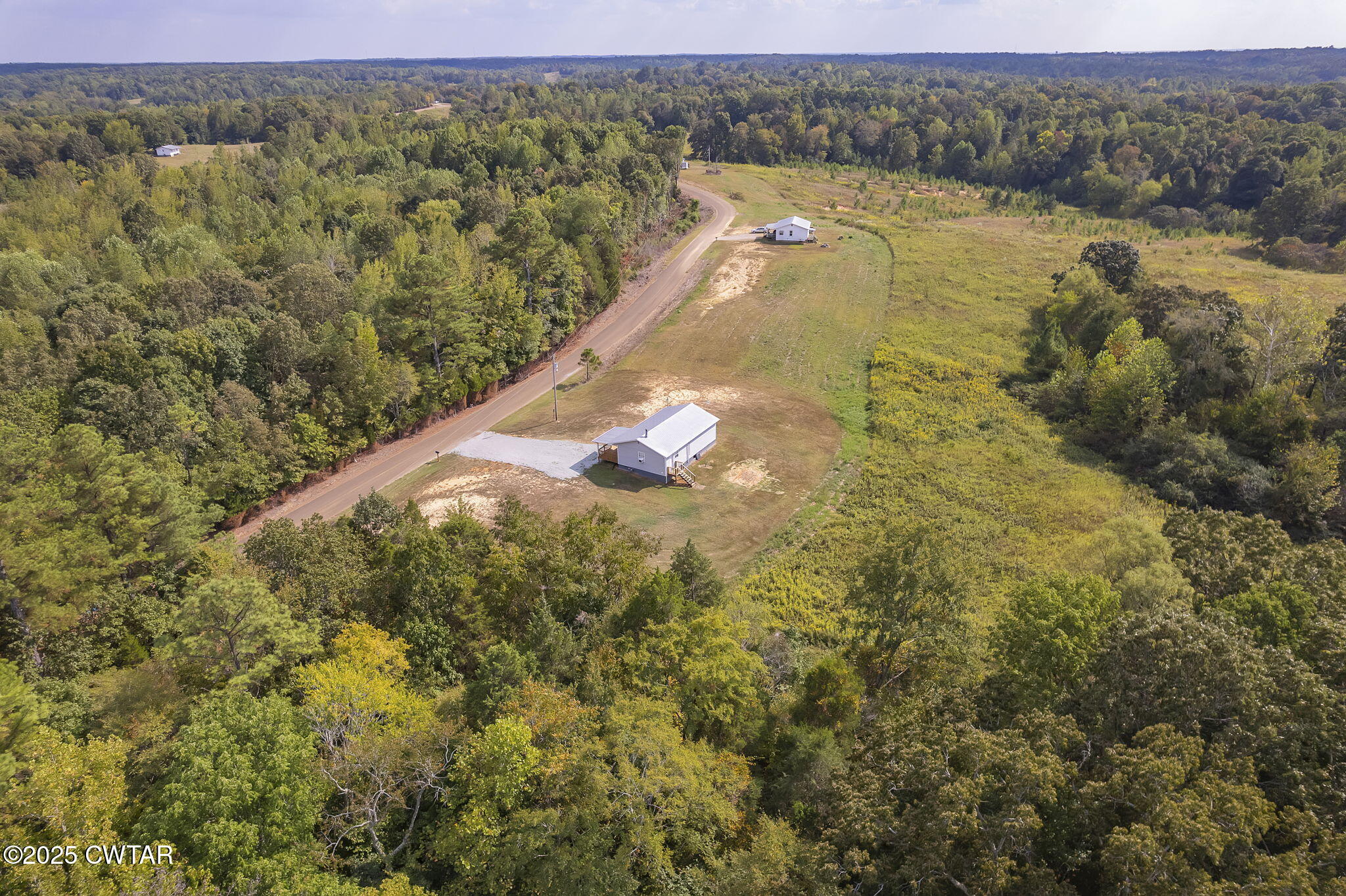 2025 Overton Loop Toone, TN 38381 - Photo 1 of 14 a view of a lake from a yard