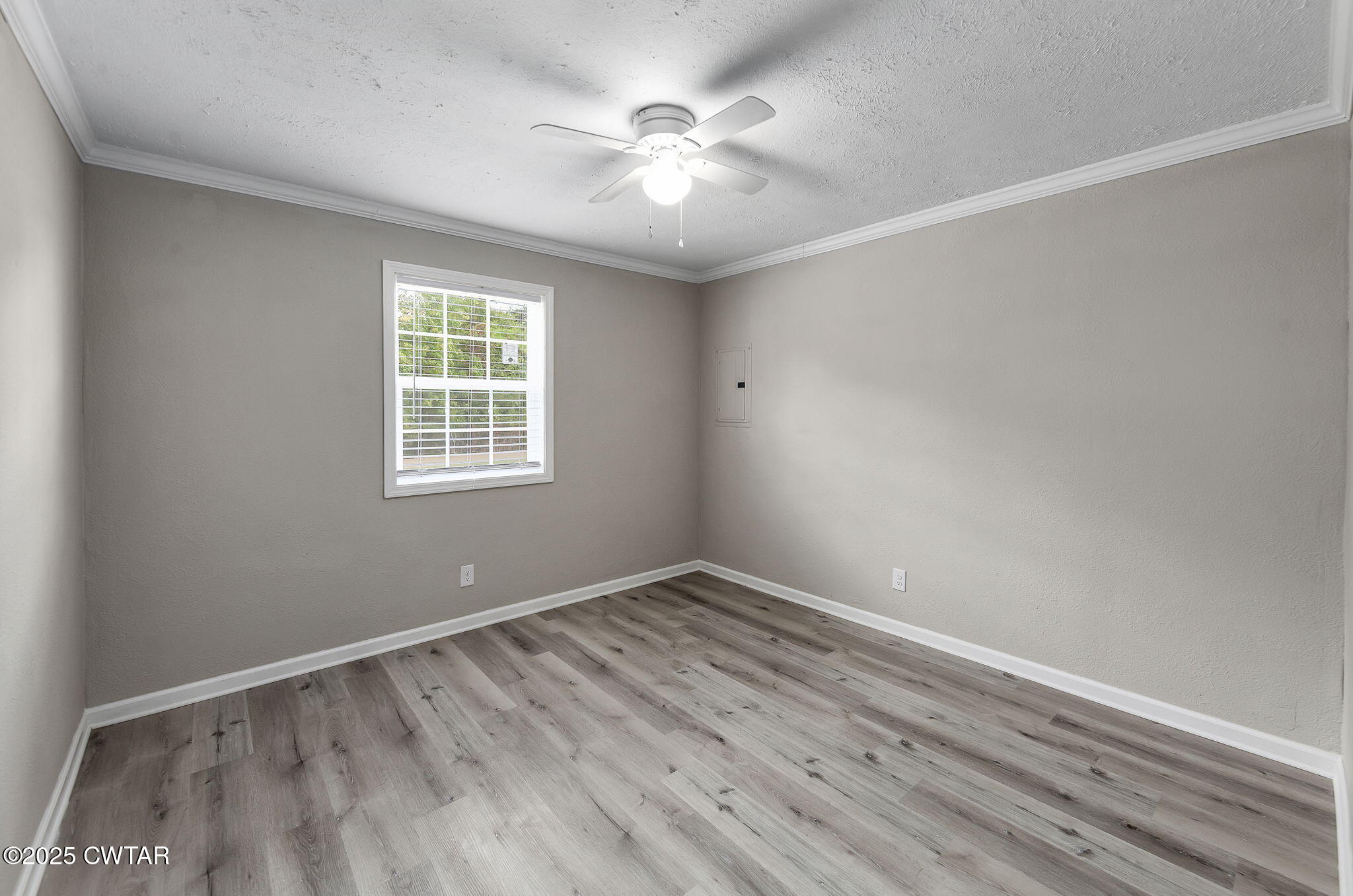 2025 Overton Loop Toone, TN 38381 - Photo 11 of 14 wooden floor in an empty room with a window