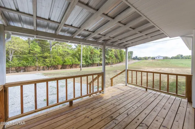 a view of balcony with wooden floor