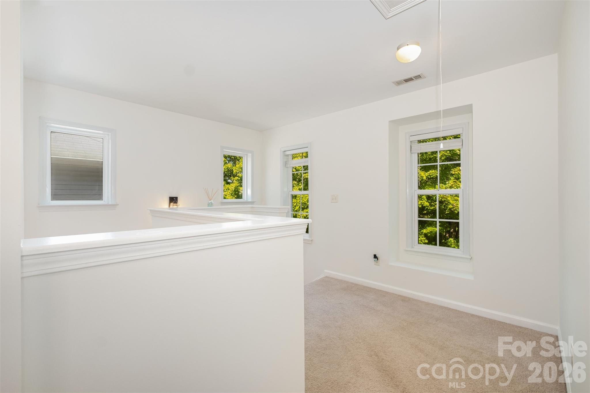 9213 Seamill Road Charlotte, NC 28278 - Photo 17 of 33 a living room with a window and a dresser