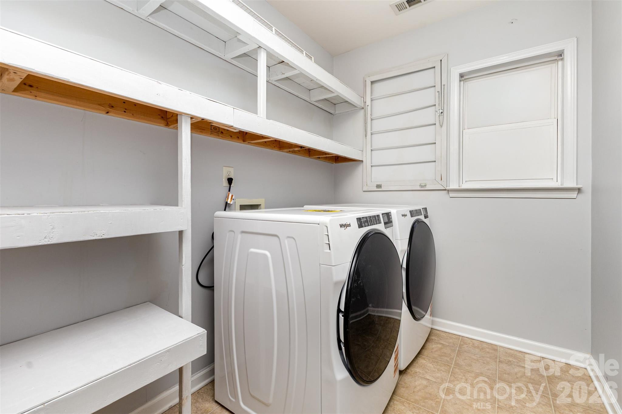 9213 Seamill Road Charlotte, NC 28278 - Photo 18 of 33 a utility room with dryer and washer