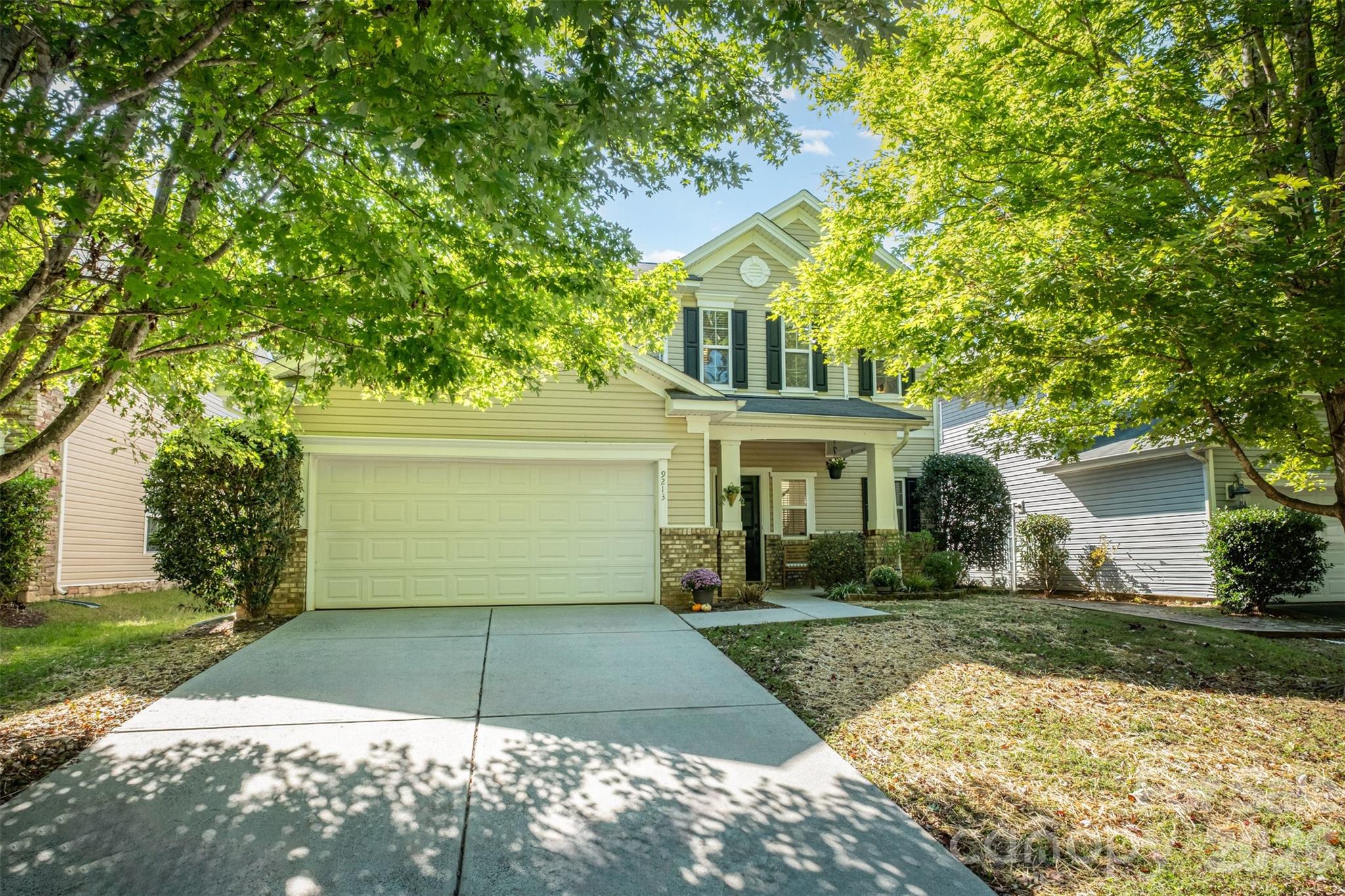 9213 Seamill Road Charlotte, NC 28278 - Photo 2 of 33 a front view of a house with a yard and garage