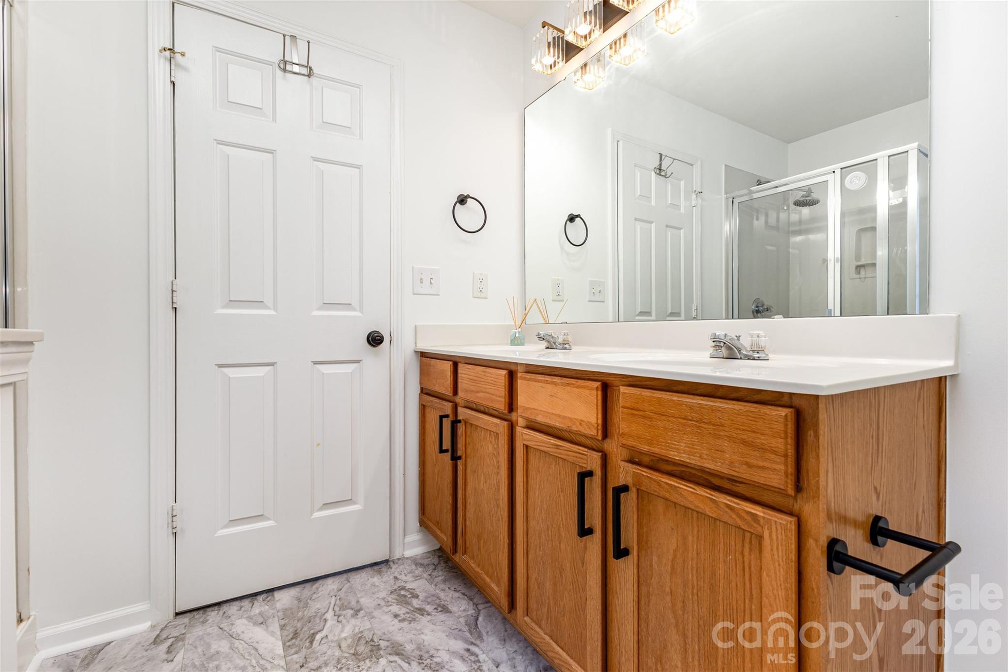 9213 Seamill Road Charlotte, NC 28278 - Photo 24 of 33 a bathroom with a sink and a mirror