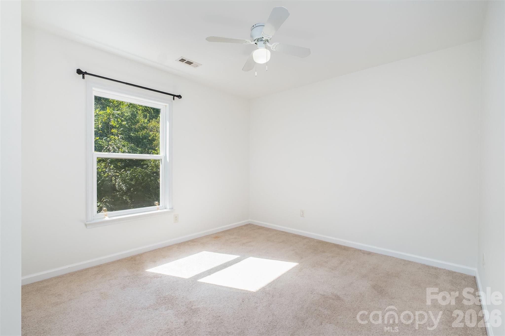 9213 Seamill Road Charlotte, NC 28278 - Photo 25 of 33 an empty room with a window