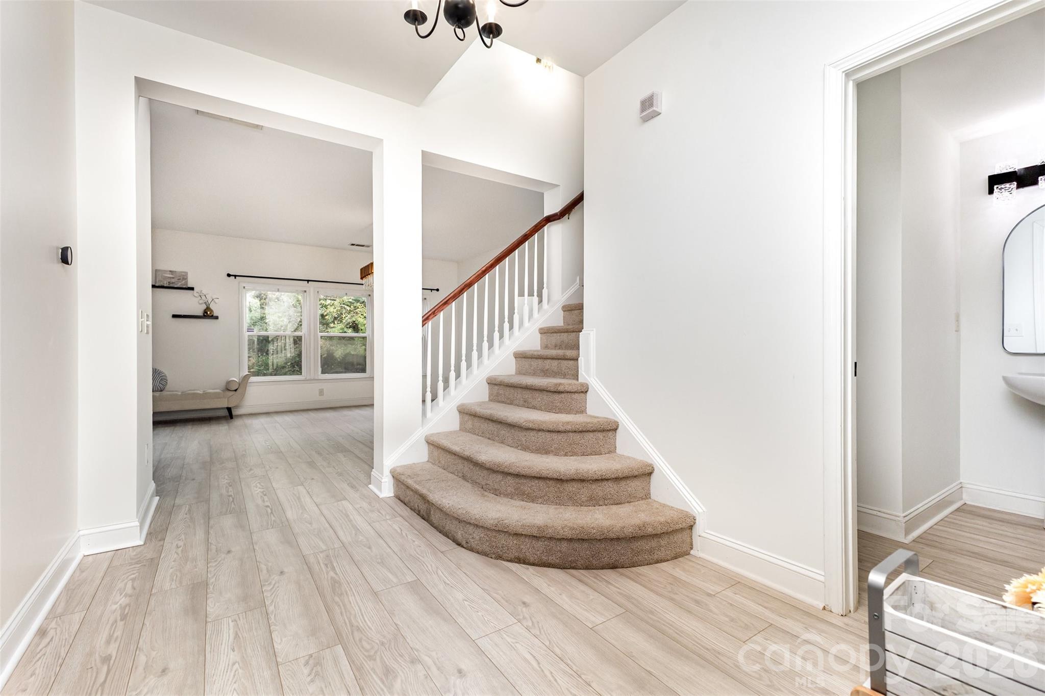 9213 Seamill Road Charlotte, NC 28278 - Photo 4 of 33 a view of entryway and hall with wooden floor