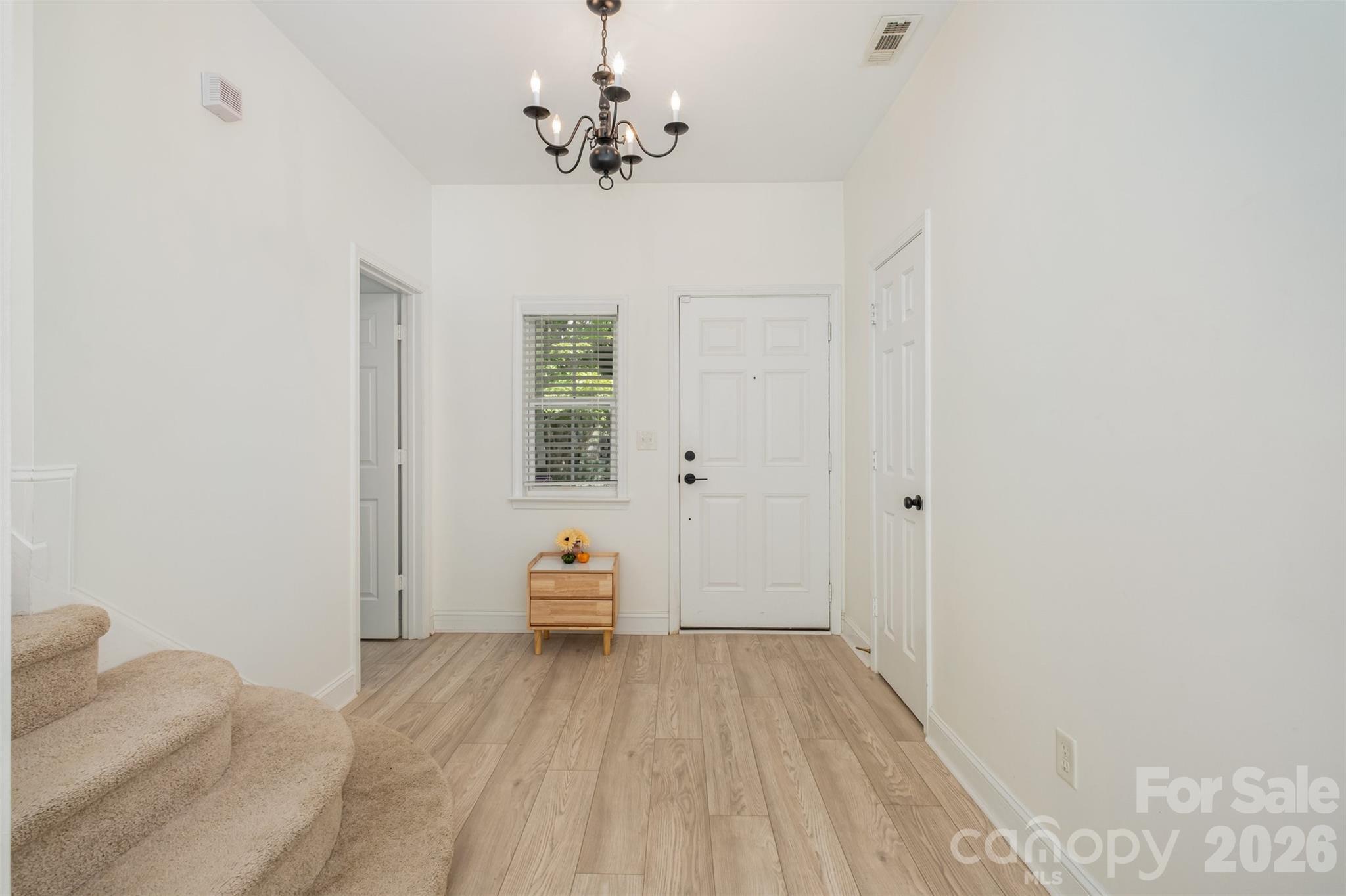 9213 Seamill Road Charlotte, NC 28278 - Photo 5 of 33 a view of a bedroom with wooden floor