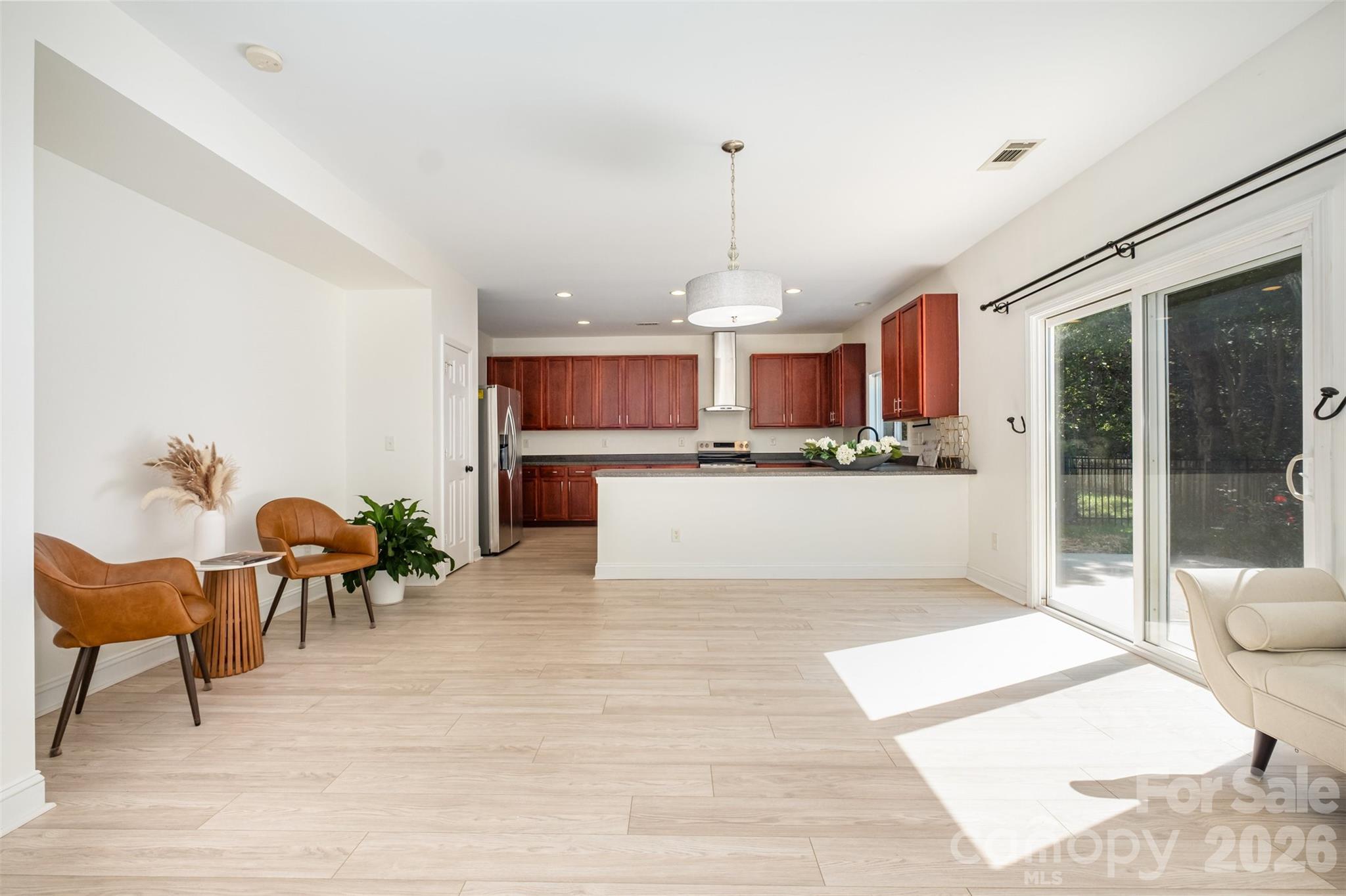 9213 Seamill Road Charlotte, NC 28278 - Photo 10 of 33 a living room with stainless steel appliances kitchen island granite countertop furniture and a kitchen view