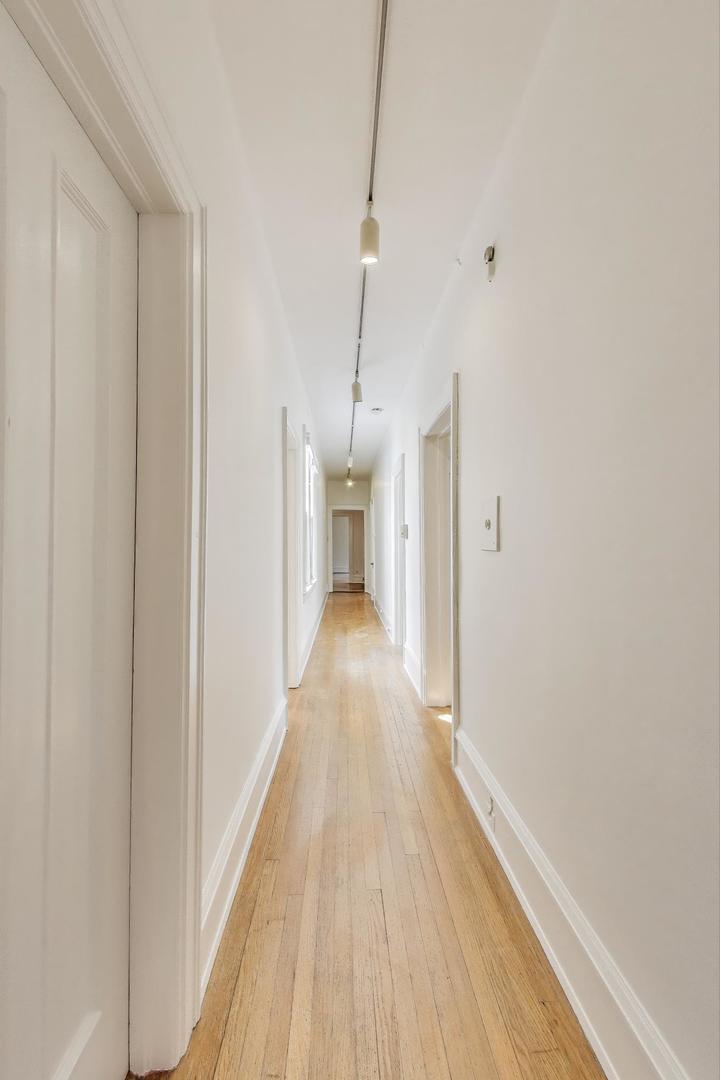 1641 Hinman Avenue, Unit 3 Evanston, IL 60201 - Photo 12 of 30 a view of a hallway with wooden floor