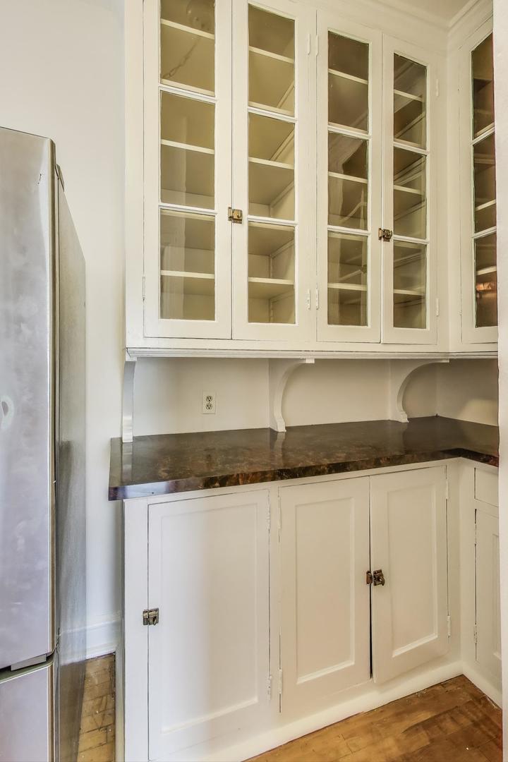 1641 Hinman Avenue, Unit 3 Evanston, IL 60201 - Photo 15 of 30 a kitchen with stainless steel appliances granite countertop a cabinets and a granite counter tops
