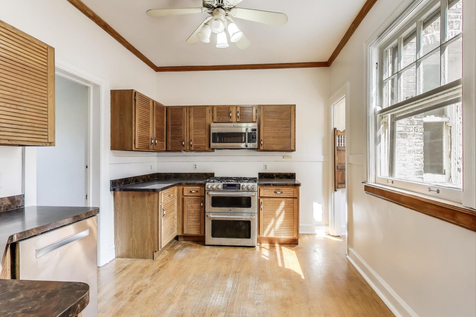 1641 Hinman Avenue, Unit 3 Evanston, IL 60201 - Photo 16 of 30 a kitchen with stainless steel appliances granite countertop a stove and a sink