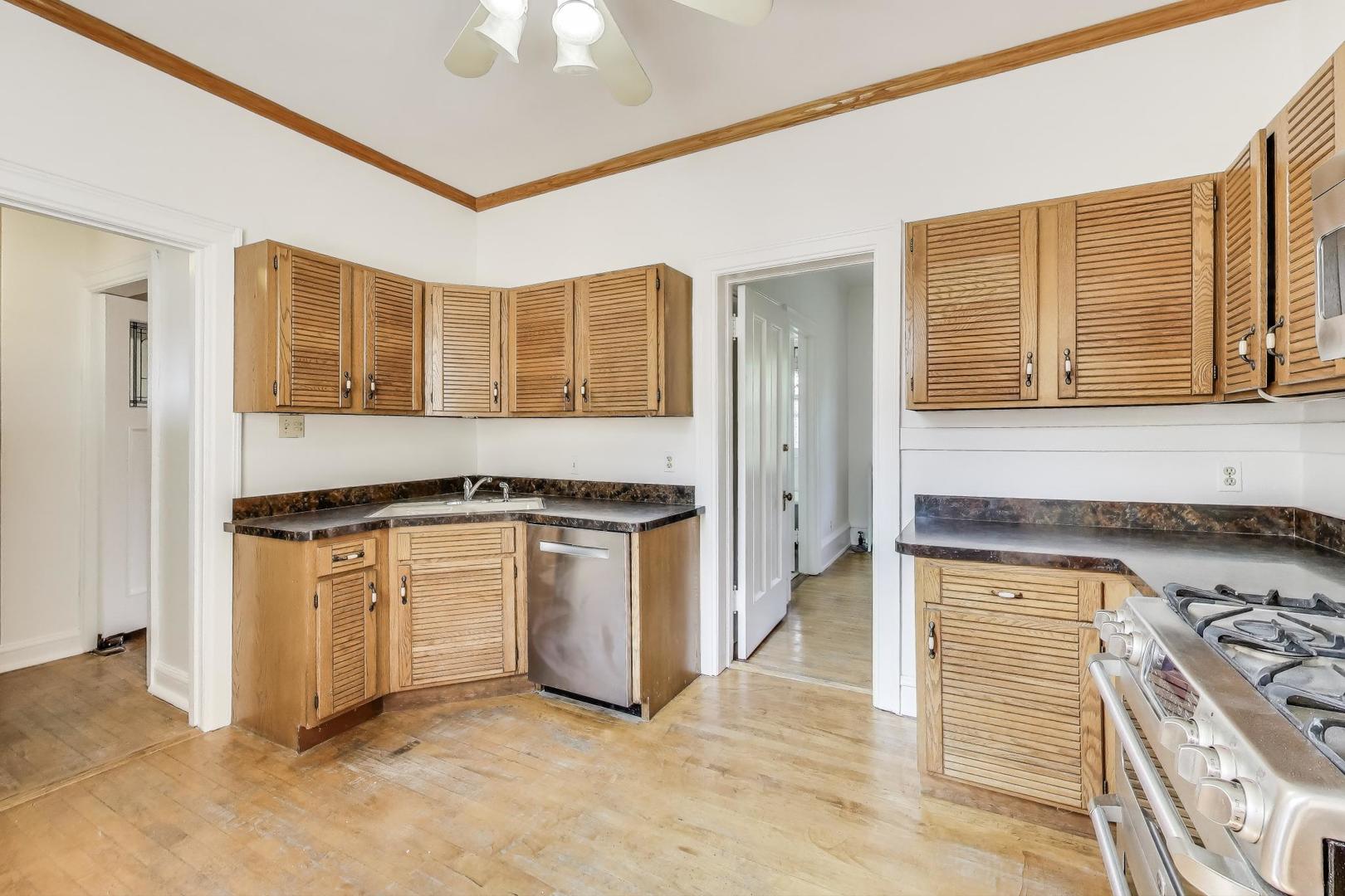 1641 Hinman Avenue, Unit 3 Evanston, IL 60201 - Photo 17 of 30 a kitchen with stainless steel appliances granite countertop a stove and a sink