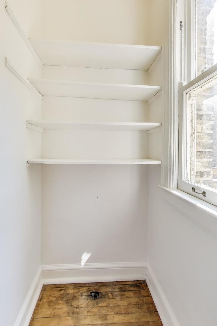 1641 Hinman Avenue, Unit 3 Evanston, IL 60201 - Photo 19 of 30 a view of small space with racks on the wall