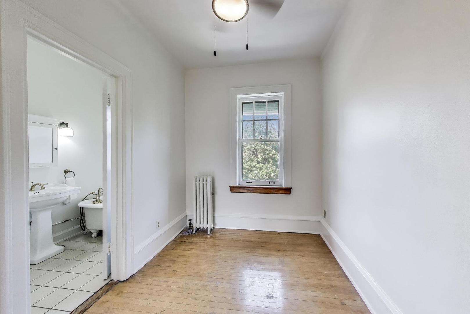1641 Hinman Avenue, Unit 3 Evanston, IL 60201 - Photo 20 of 30 a view of a room with wooden floor and a window