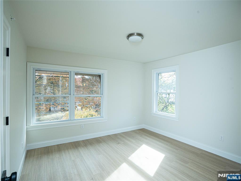 490 Broad Avenue, Unit 6 Leonia, NJ 07605 - Photo 3 of 8 a view of an empty room and a window