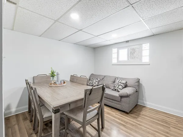 a view of a dining room with furniture and wooden floor