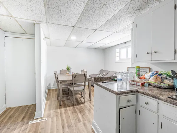 a kitchen with a sink a stove cabinets and counter space